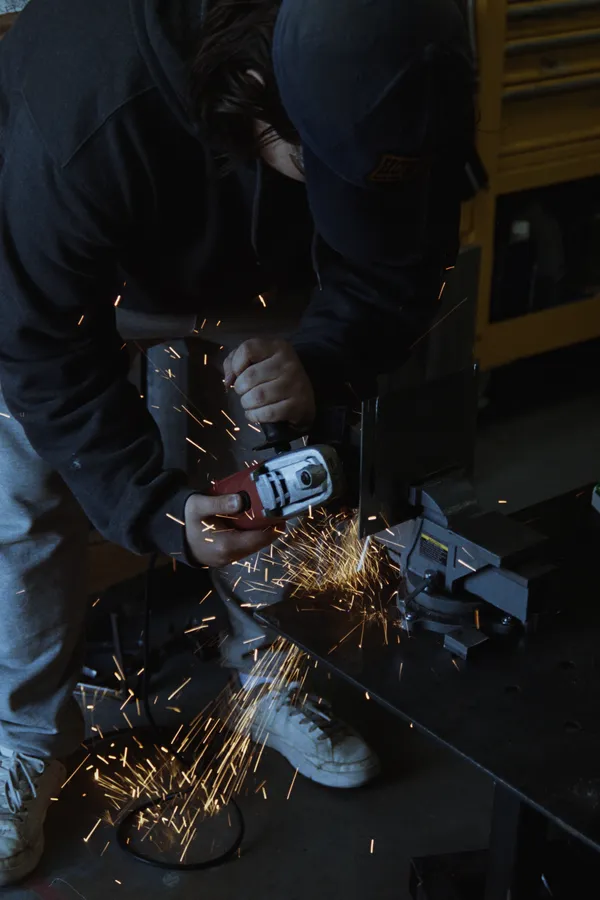 Metal grinding with sparks in an ArtLab studio